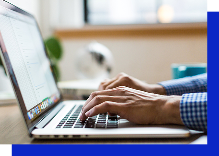 image of a man using a laptop